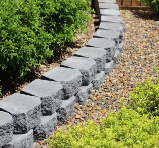 Curved_garden_edging_Classic_Wall_Charcoal_with_Pebbled_landscape