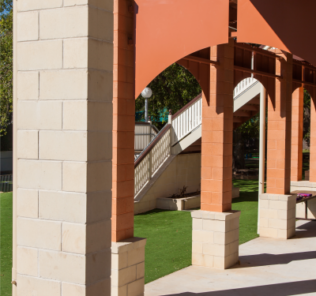 Pillars_created_using_Canyon_and Ivory_smooth_faced_masonry_blocks_matching_the_aesthetics_of_the_school_building