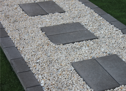 Cheap_way_to_create_stepping_stones_with_Charcoal_pavers_set_in_with_white_pebbles